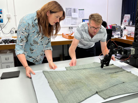 Senior conservation scientist undertaking microfading testing