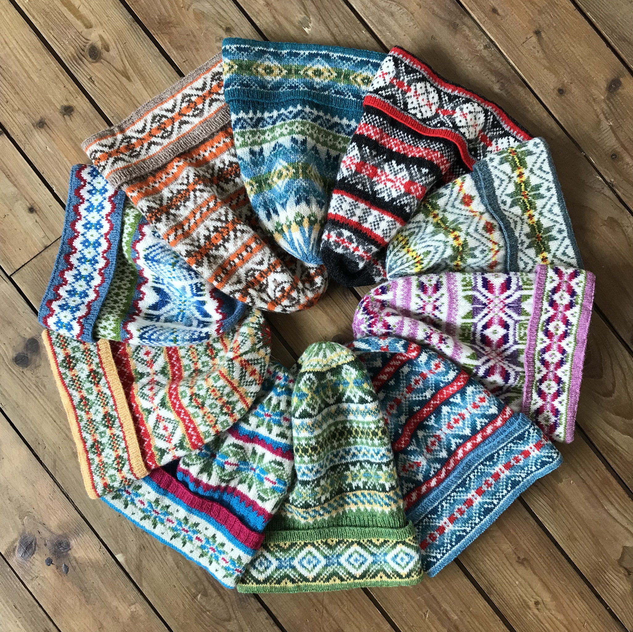 Ten Fair Isle fishermen’s keps, designed and handknitted on Fair Isle by Jennifer Daley, 2023